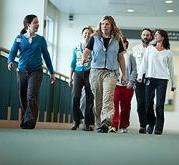 Group of employees walking on Level 5 East Mall