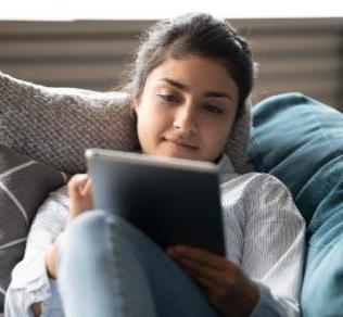 Woman using MyDH on computer