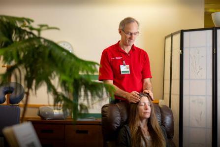 Volunteer Bill Hammond with a patient